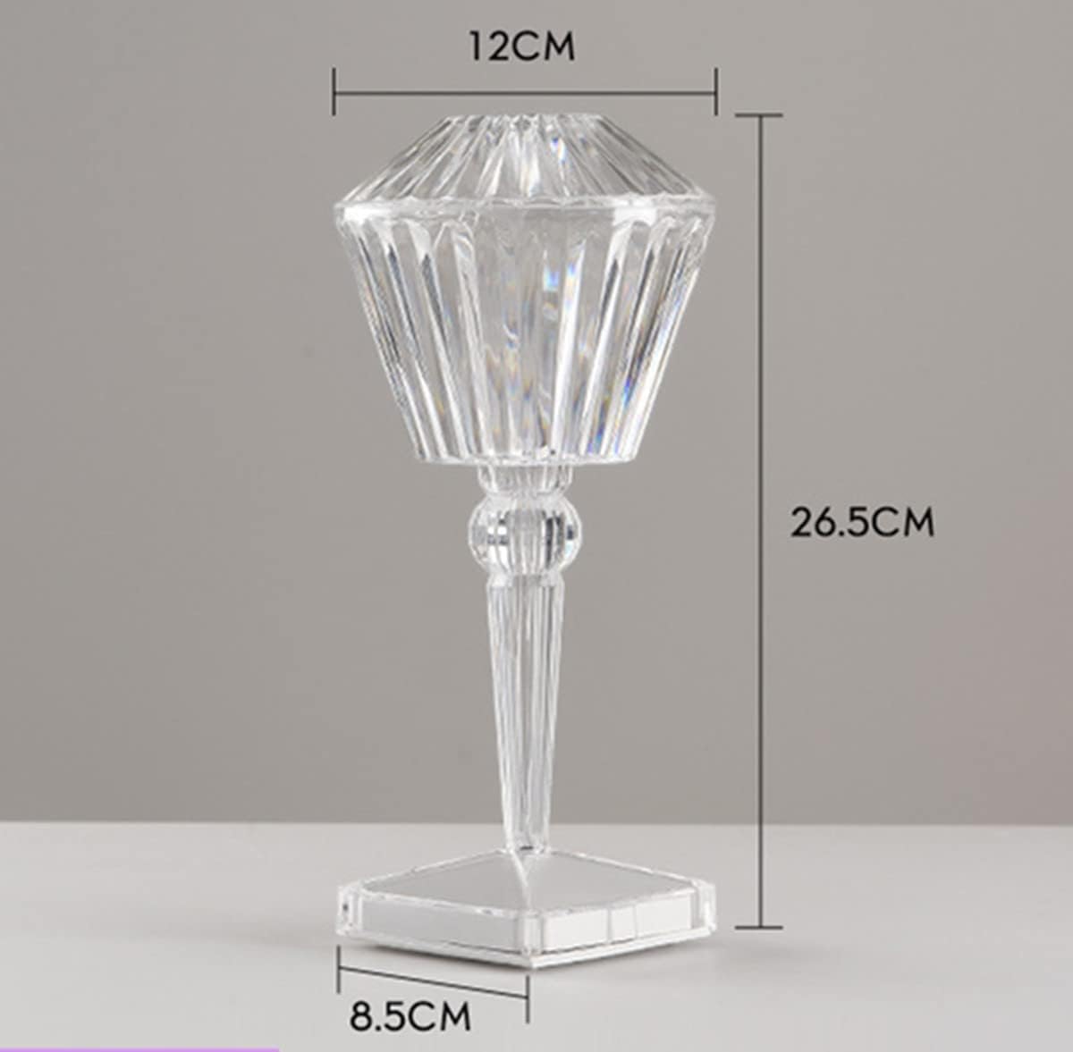 Clear glass candle holder with dimensions on a gray background