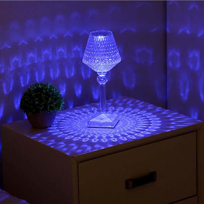 Decorative lamp with blue light projection on a wooden surface