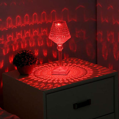 Decorative lamp with red light projection on a surface