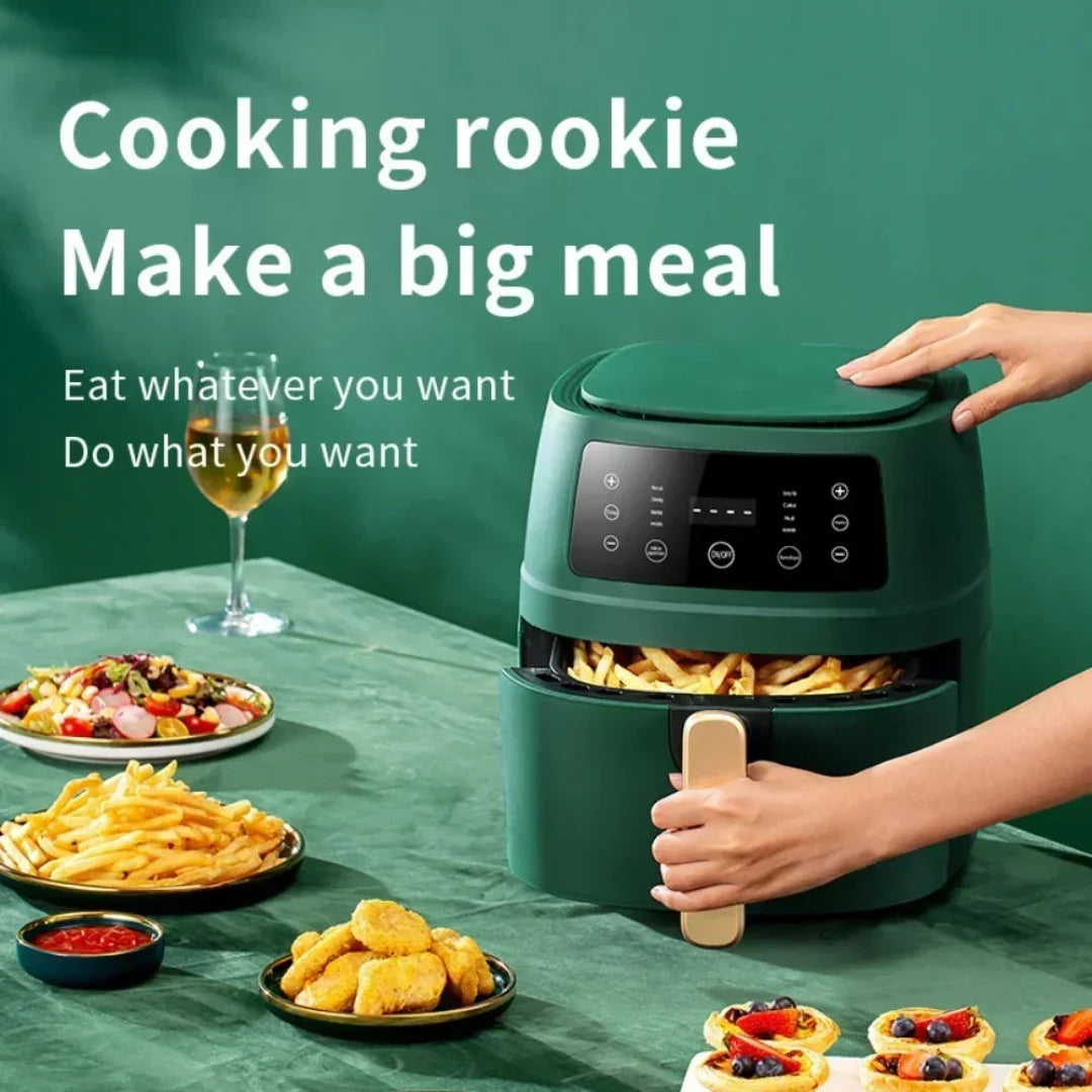 Green air fryer on a table with plates of food and a glass of wine, against a green background.