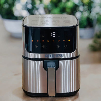 Philips air fryer on a kitchen counter with a blurred background