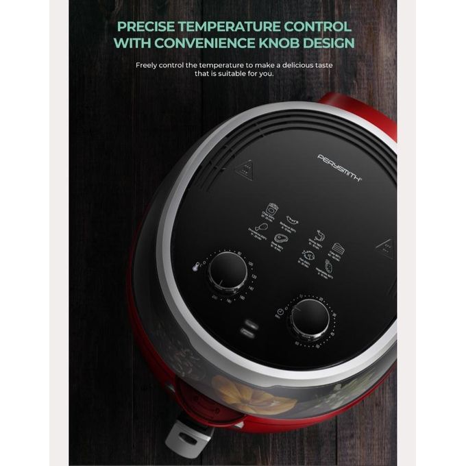 Red and black food processor with temperature control knobs on a wooden surface