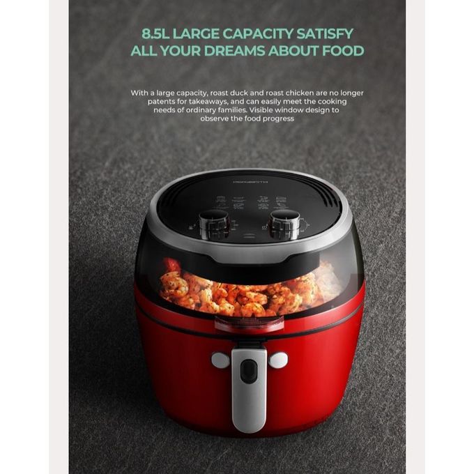 Red and black food processor with visible food inside on a dark background