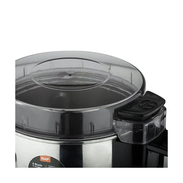 Stainless steel food processor with clear lid on a white background